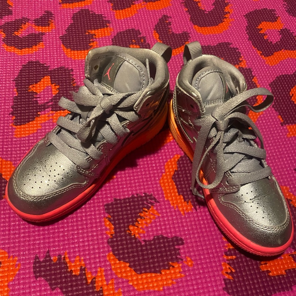 Preschool girls Air Jordan’s size 11. Silver with multicolored sole.